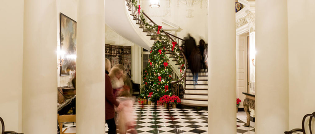 Staircase surrounded by Christmas decor at Atlanta History Center
